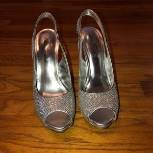 Silver sparkly heels in a 7 1/2